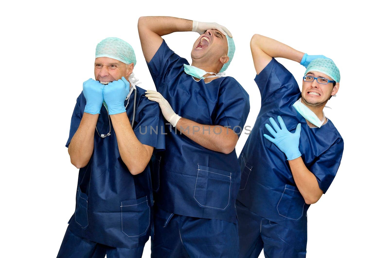 Doctors team in uniform making funny faces isolated in white
