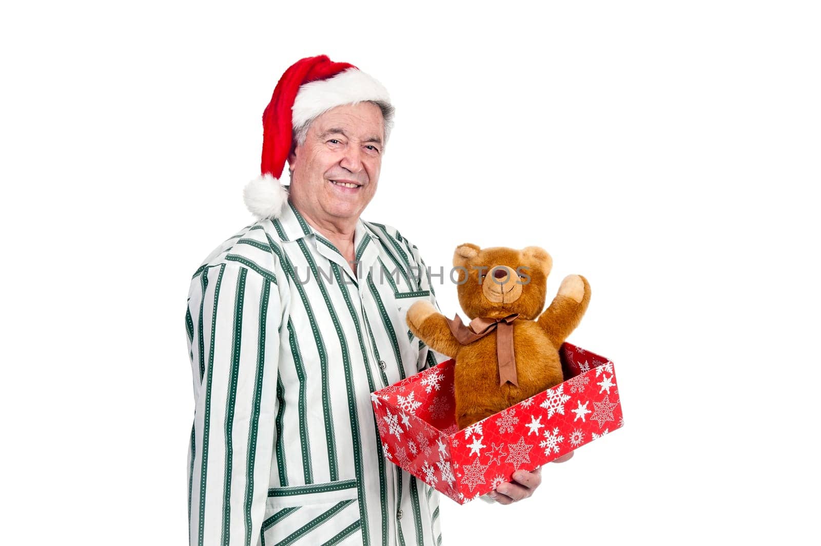Happy senior with Christmas hat and gift box