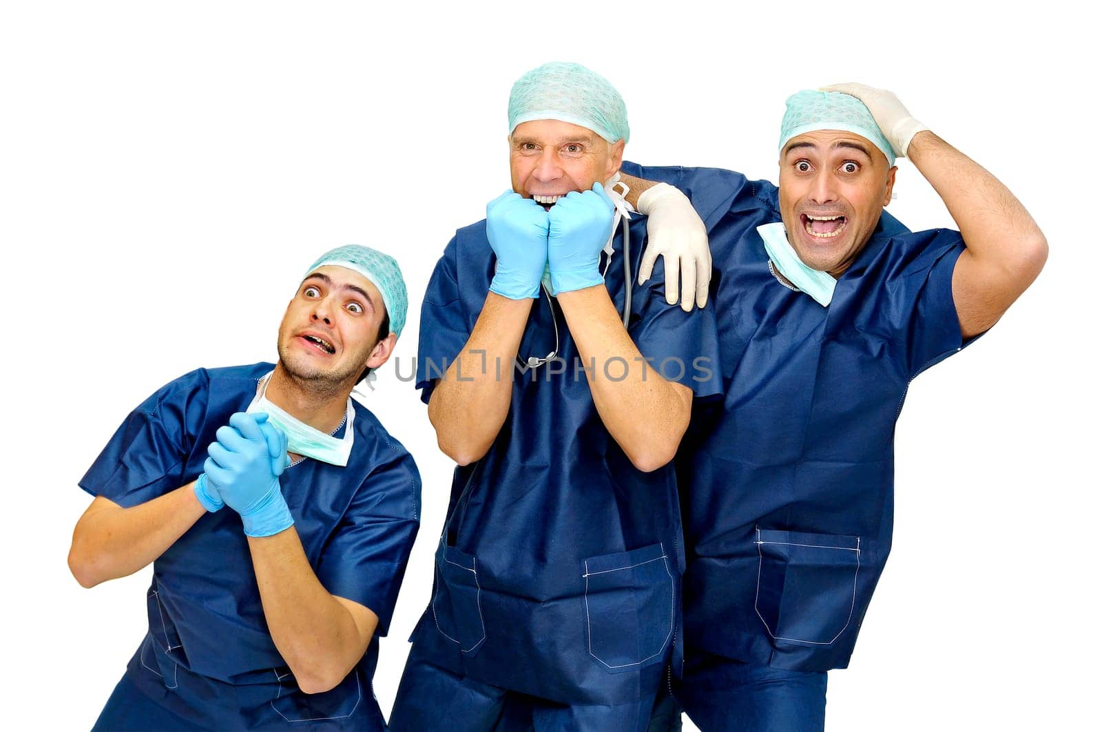 Doctors team in uniform making funny faces isolated in white