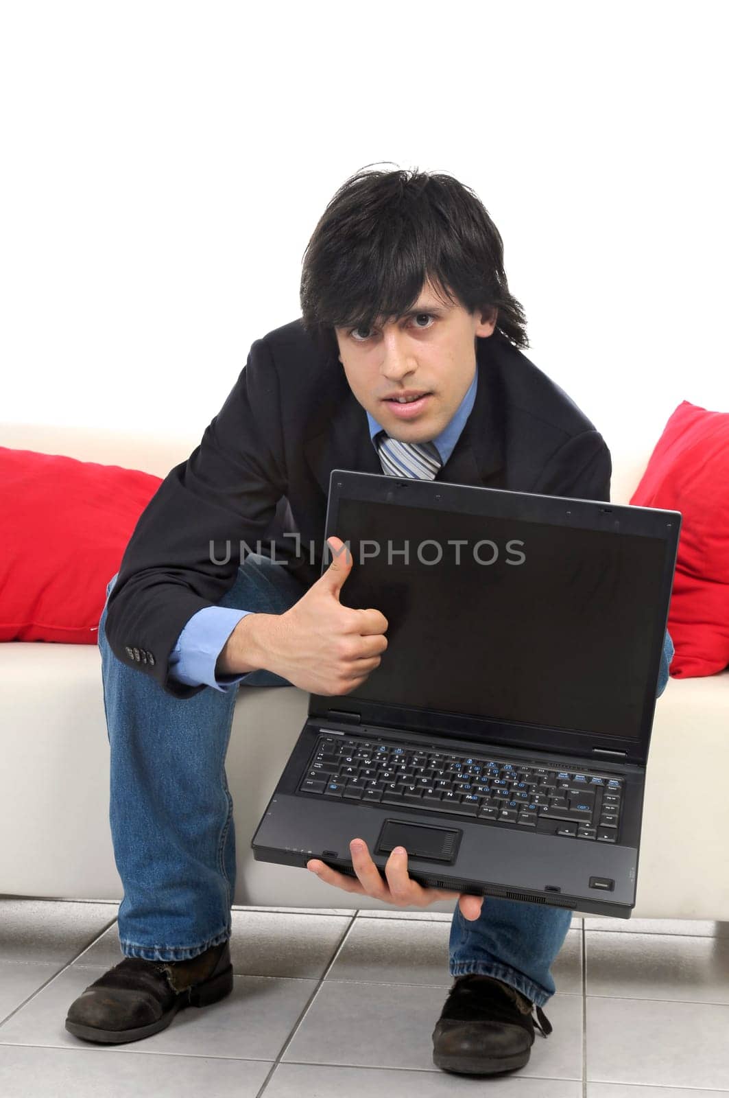 Business man with laptop isolated in white