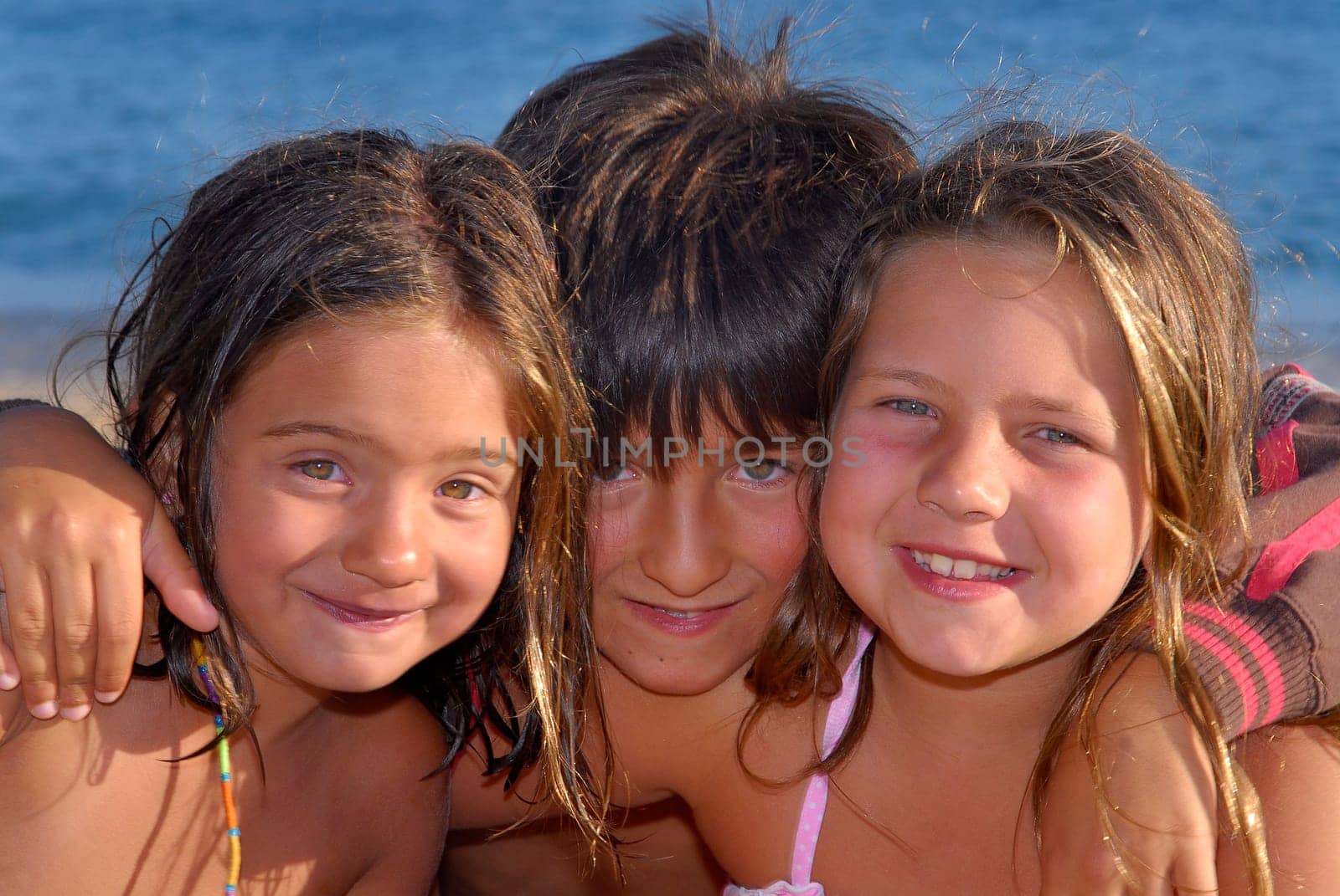 Three brothers in the beach