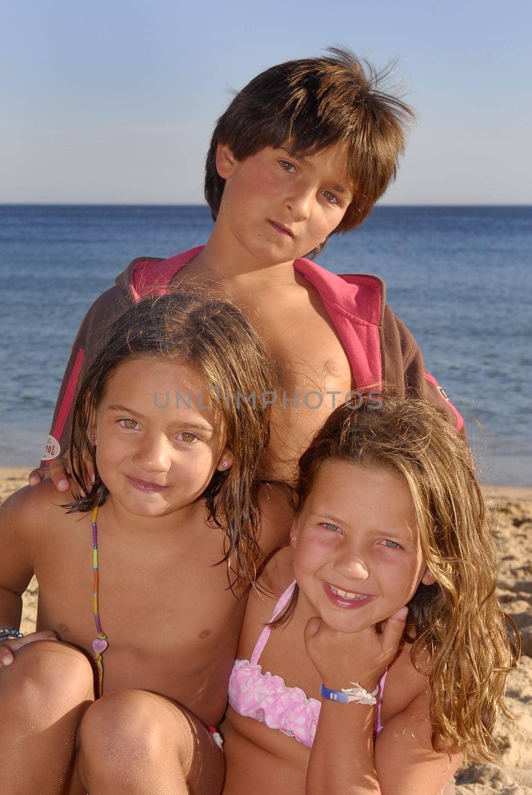 Three brothers in the beach