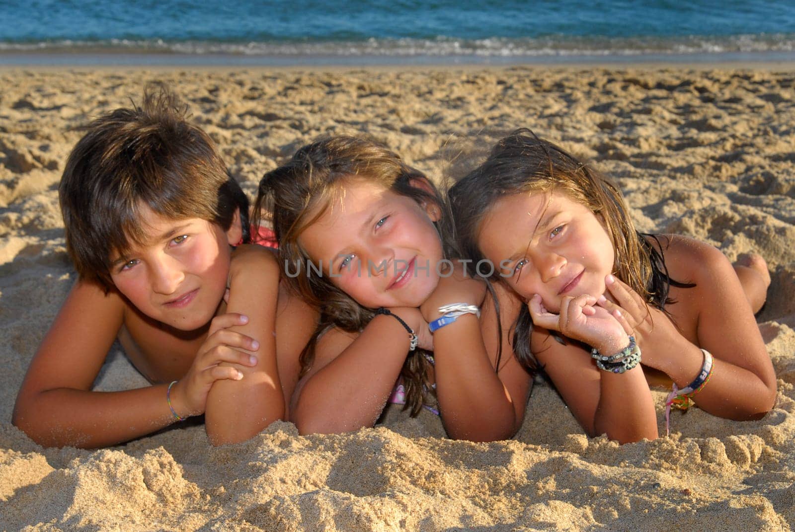 Three brothers in the beach