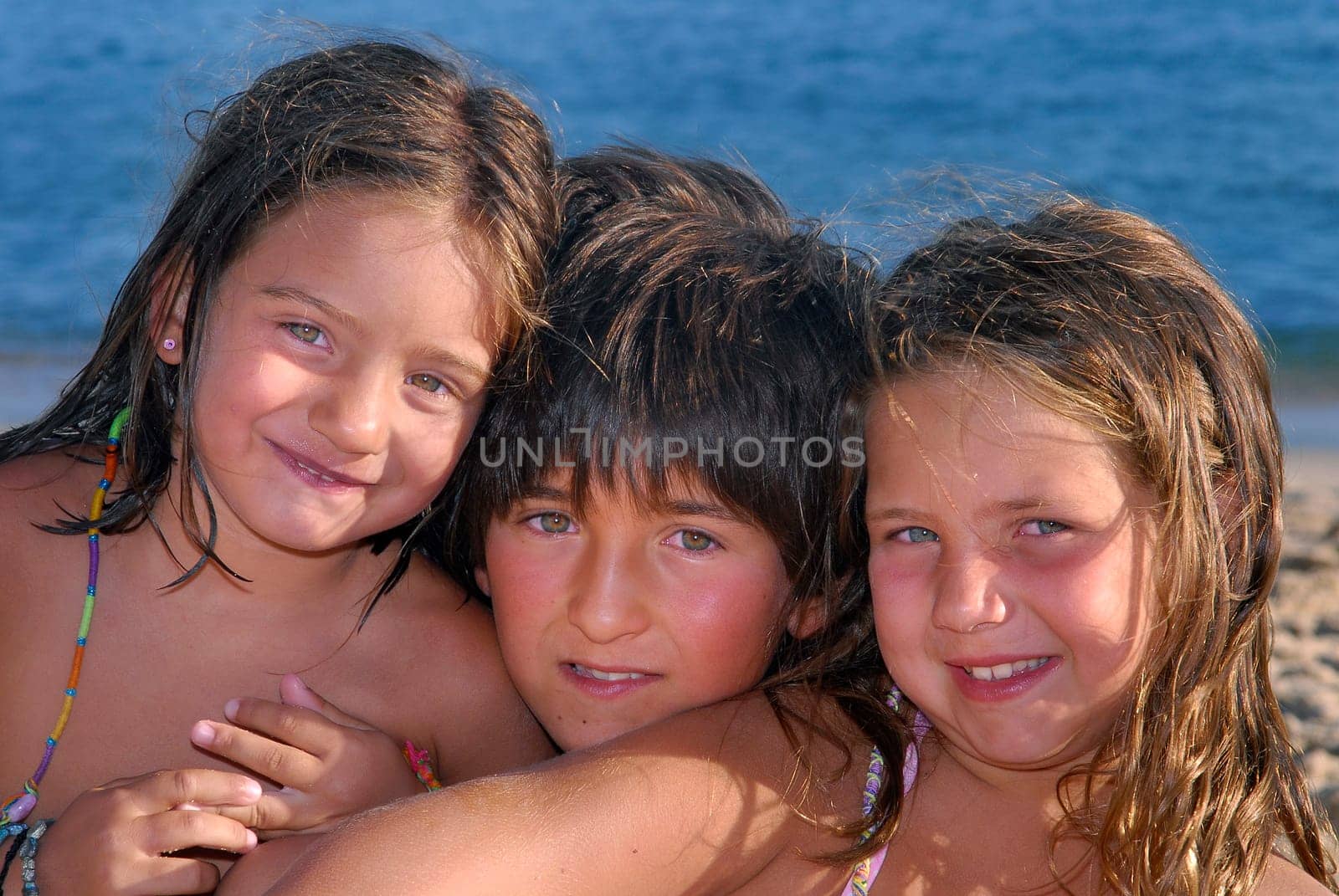 Three brothers in the beach