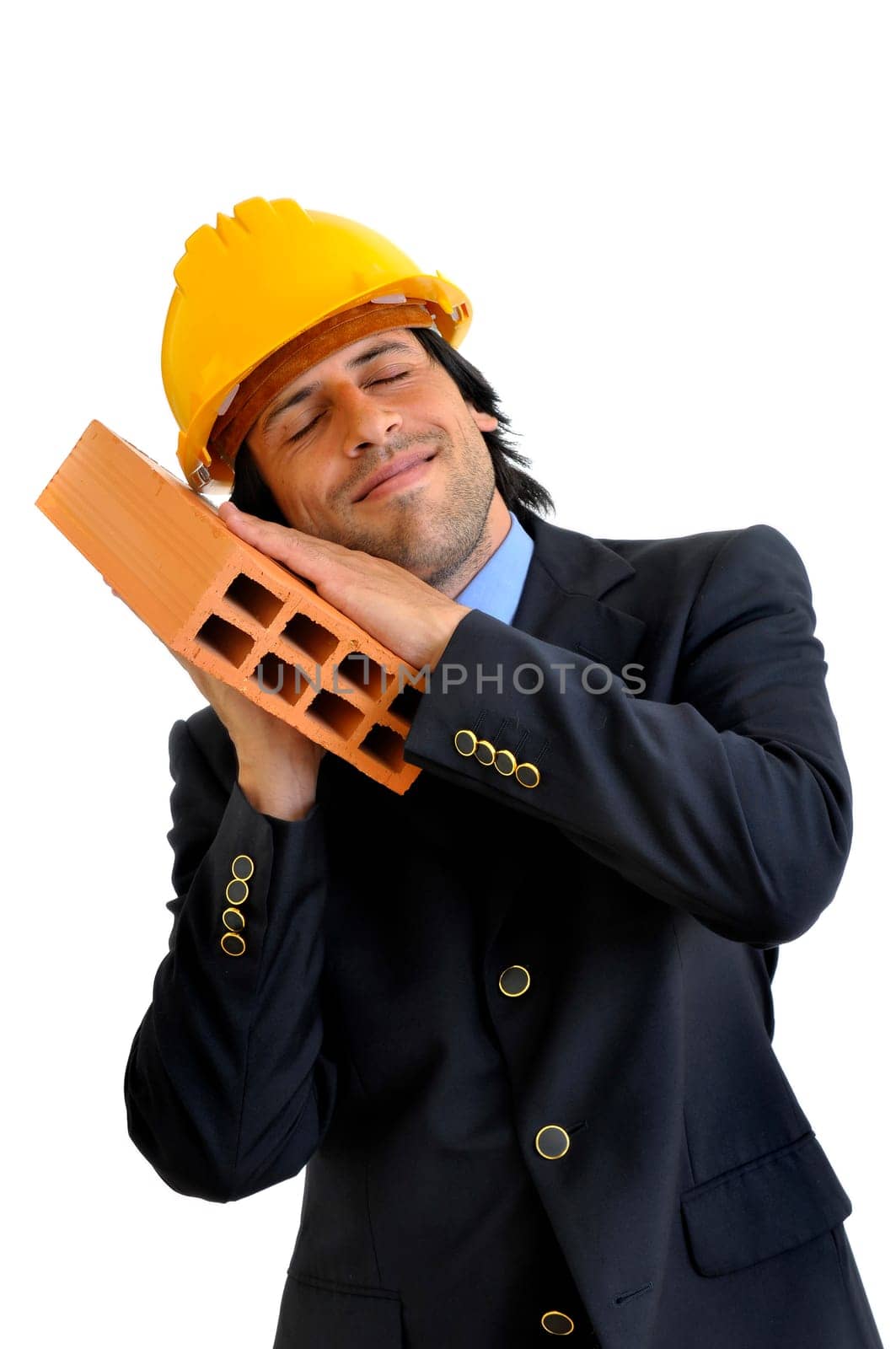 Engineer with a brick isolated in white