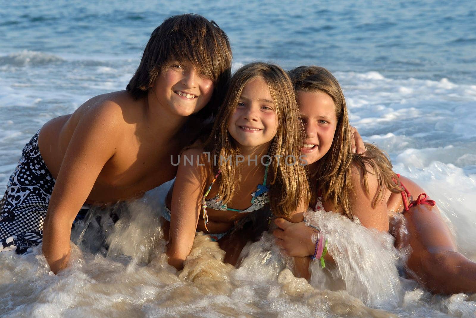 Three brothers posing in the beach