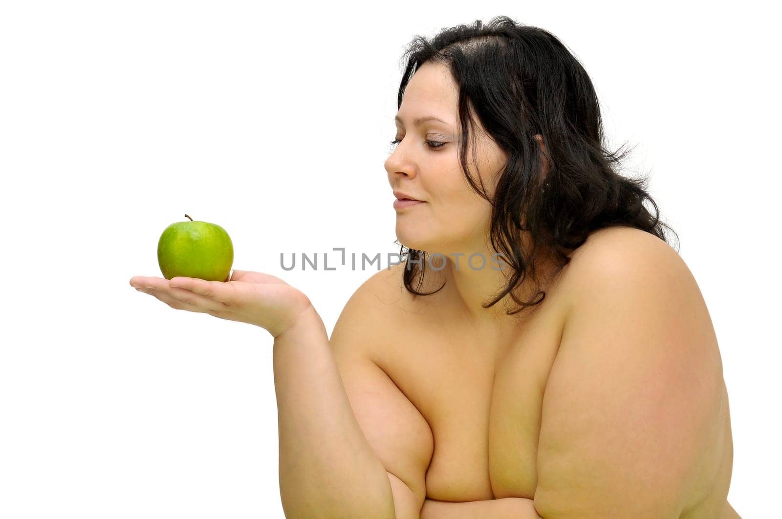 Beautiful nude large girl with an apple isolated in white
