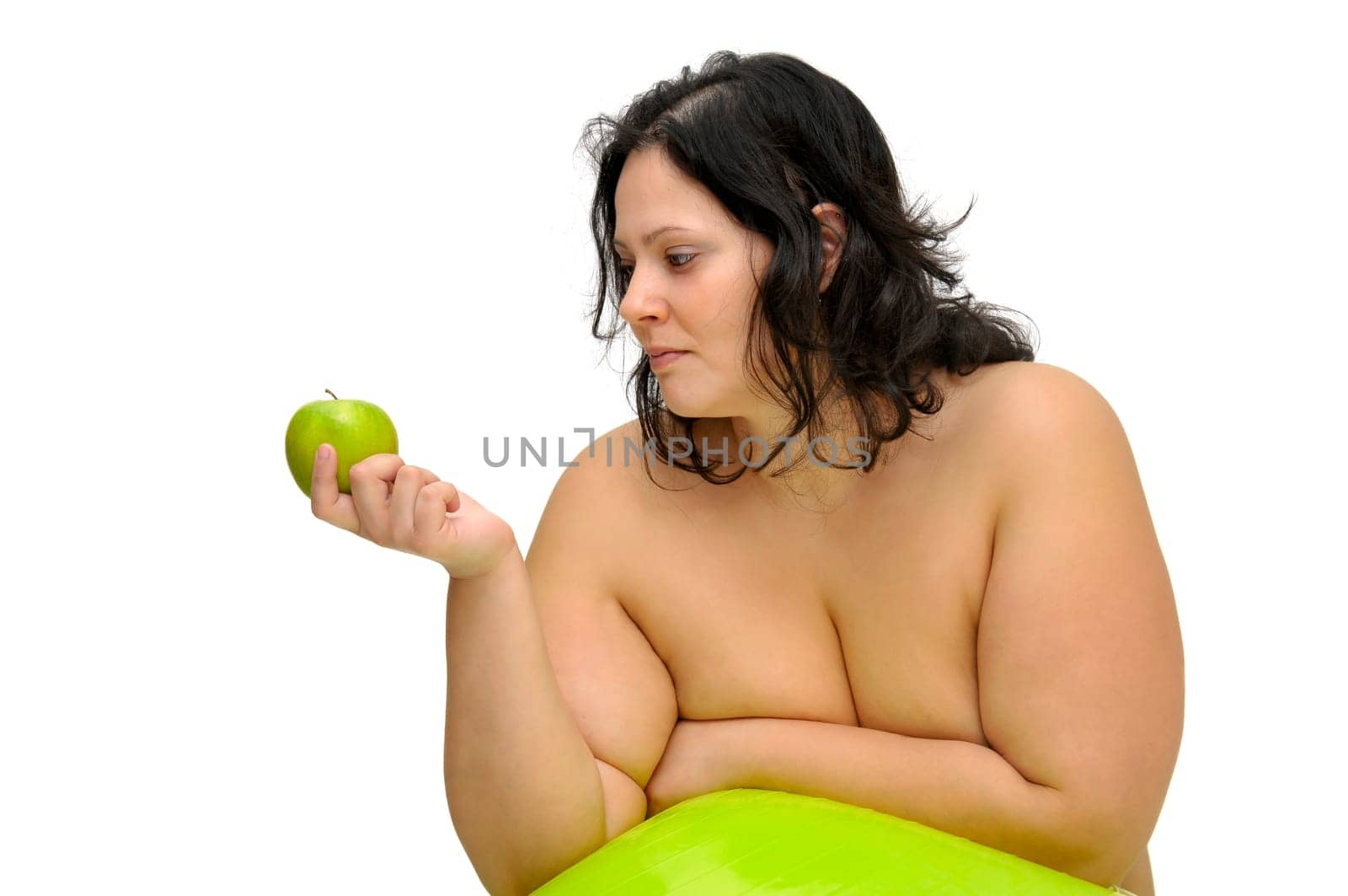 Beautiful nude large girl with an apple isolated in white