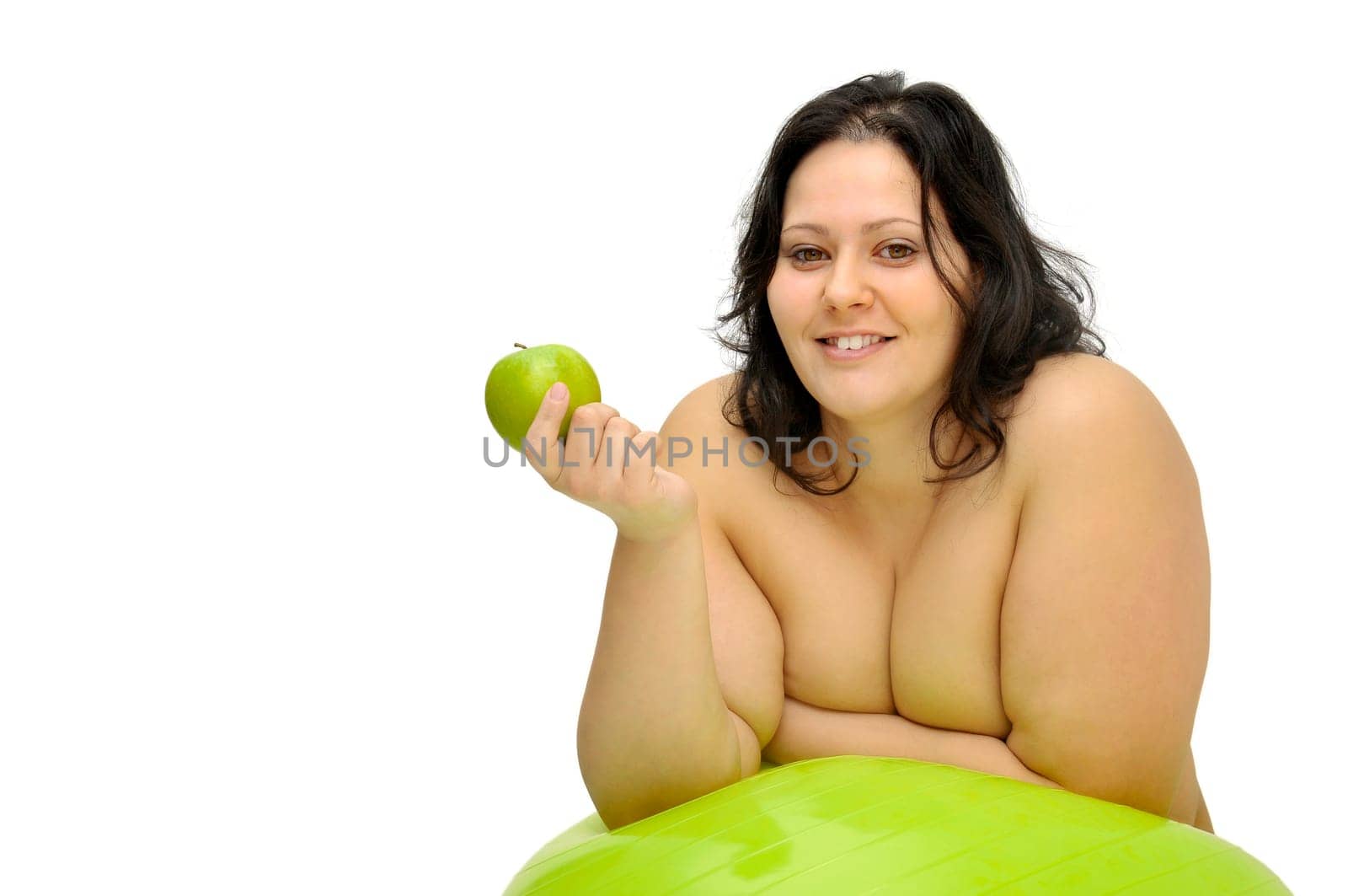 Beautiful nude large girl with an apple isolated in white