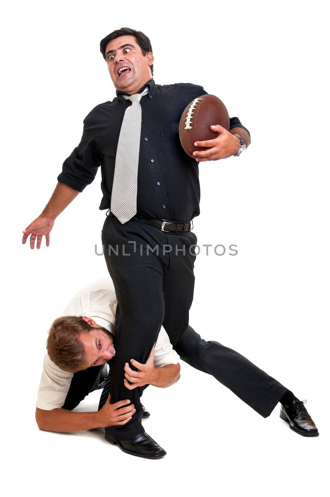 Businessmen playing rugby isolated in white
