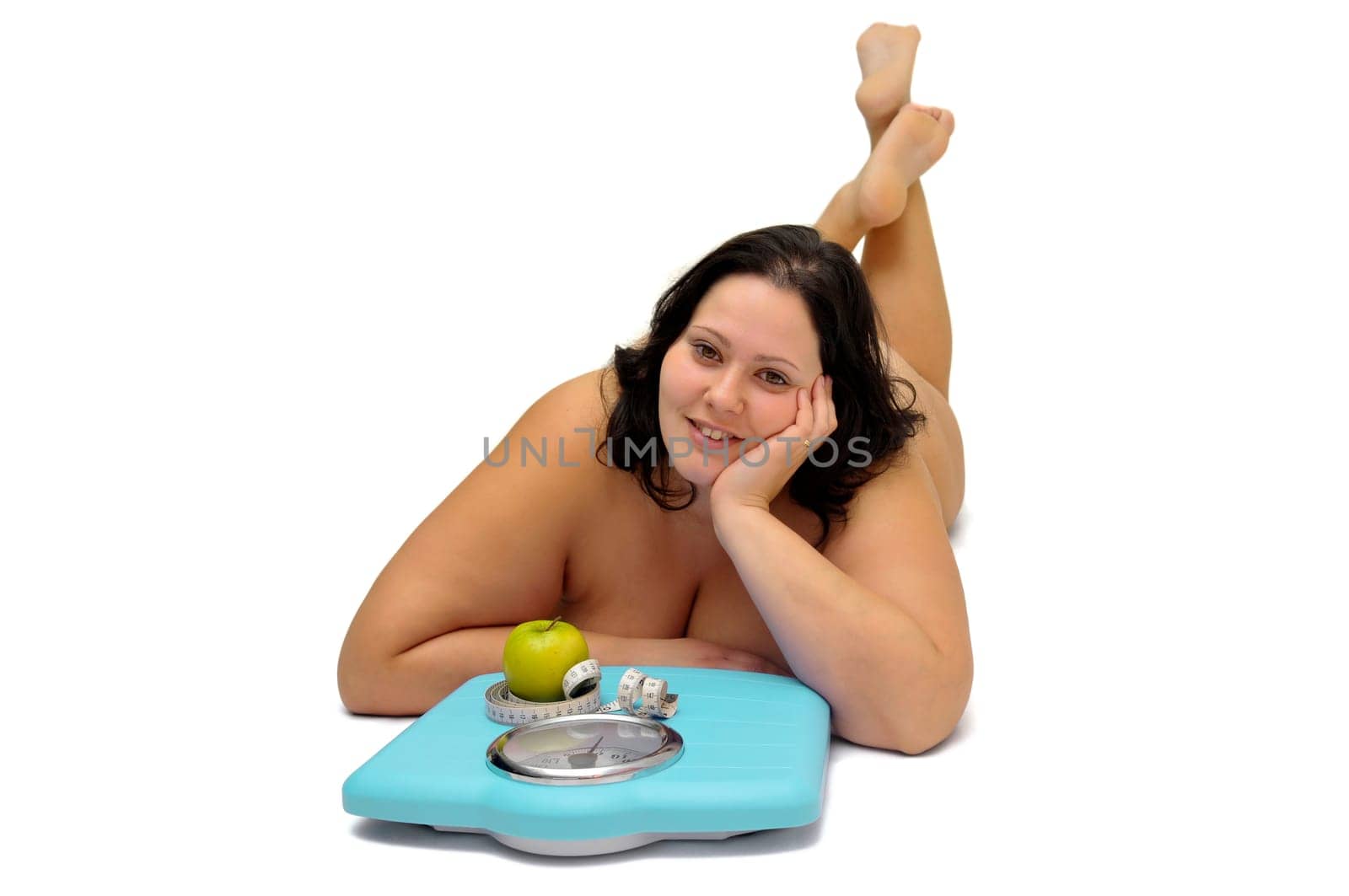 Beautiful nude large girl with weight scale isolated in white