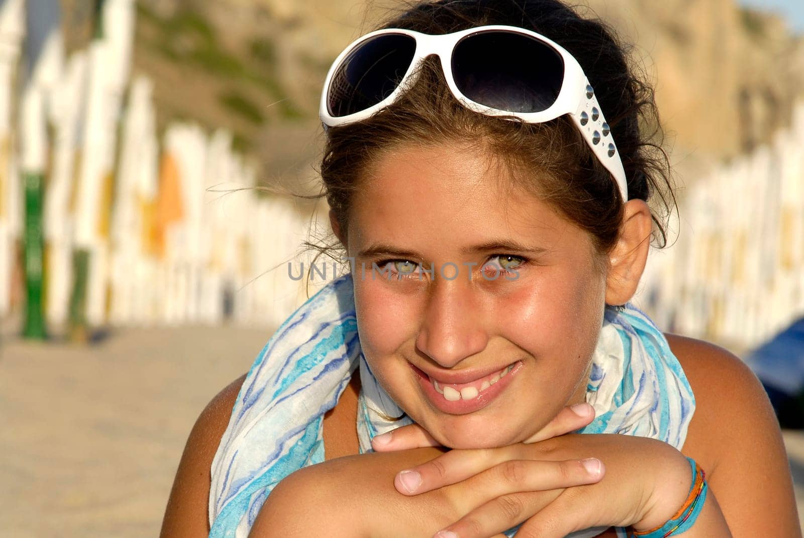 Beautiful young girl posing in the beach
