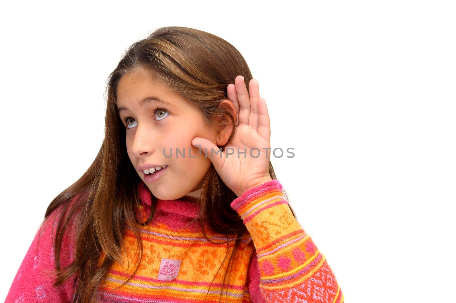 Beautiful young girl listening isolated against a white background