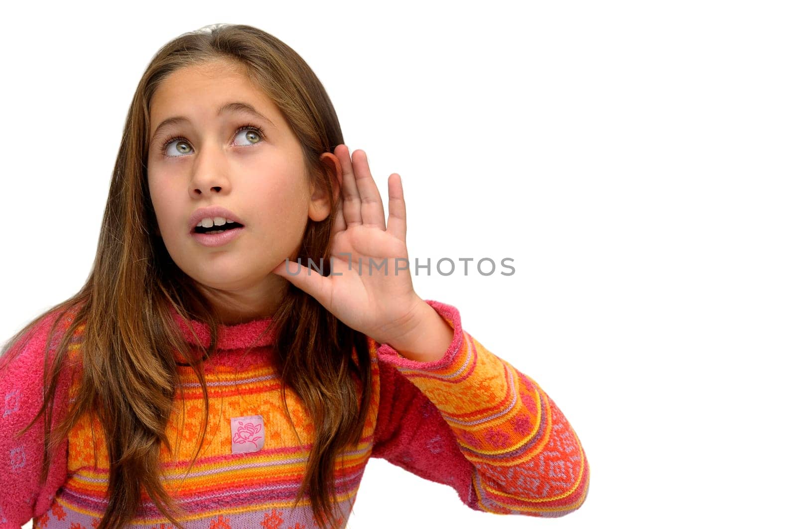 Beautiful young girl listening isolated against a white background