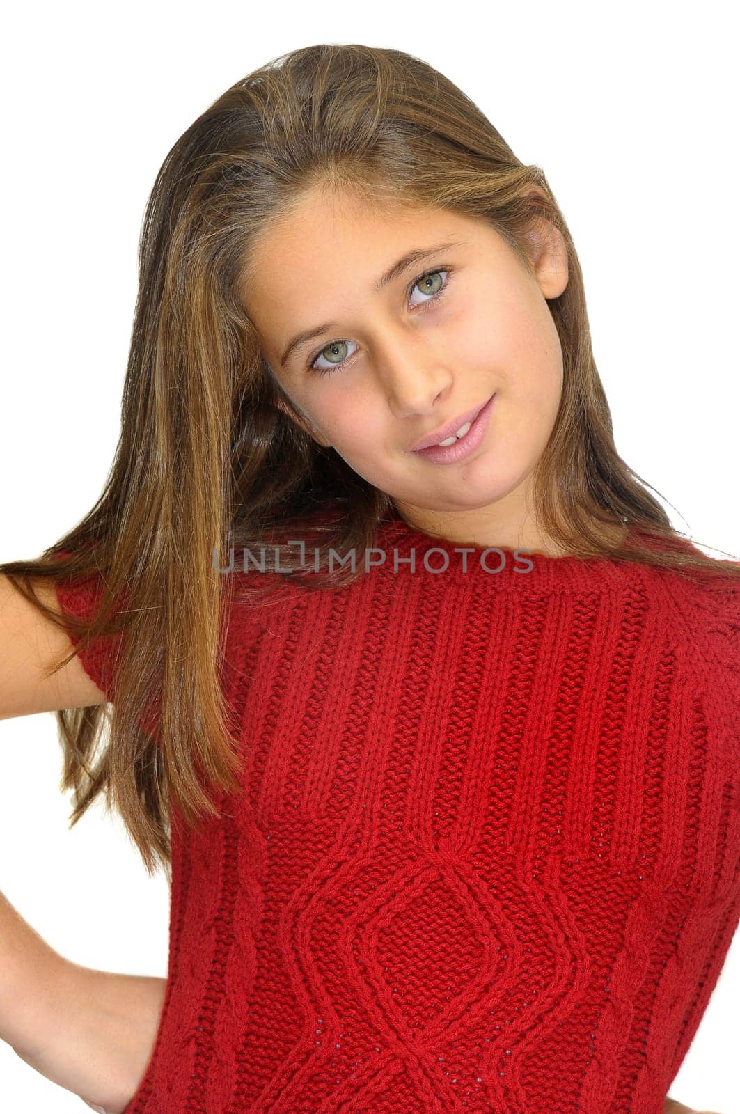 Beautiful young girl posing against a white background