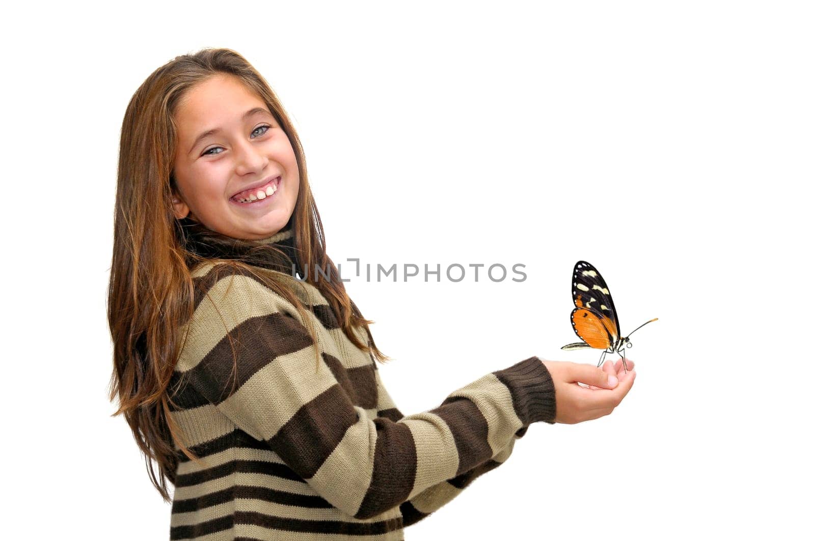 Beautiful young girl posing against a white background