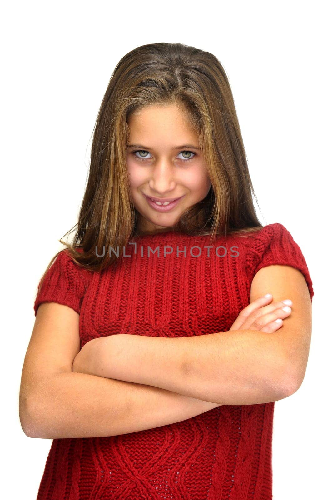 Beautiful young girl posing against a white background