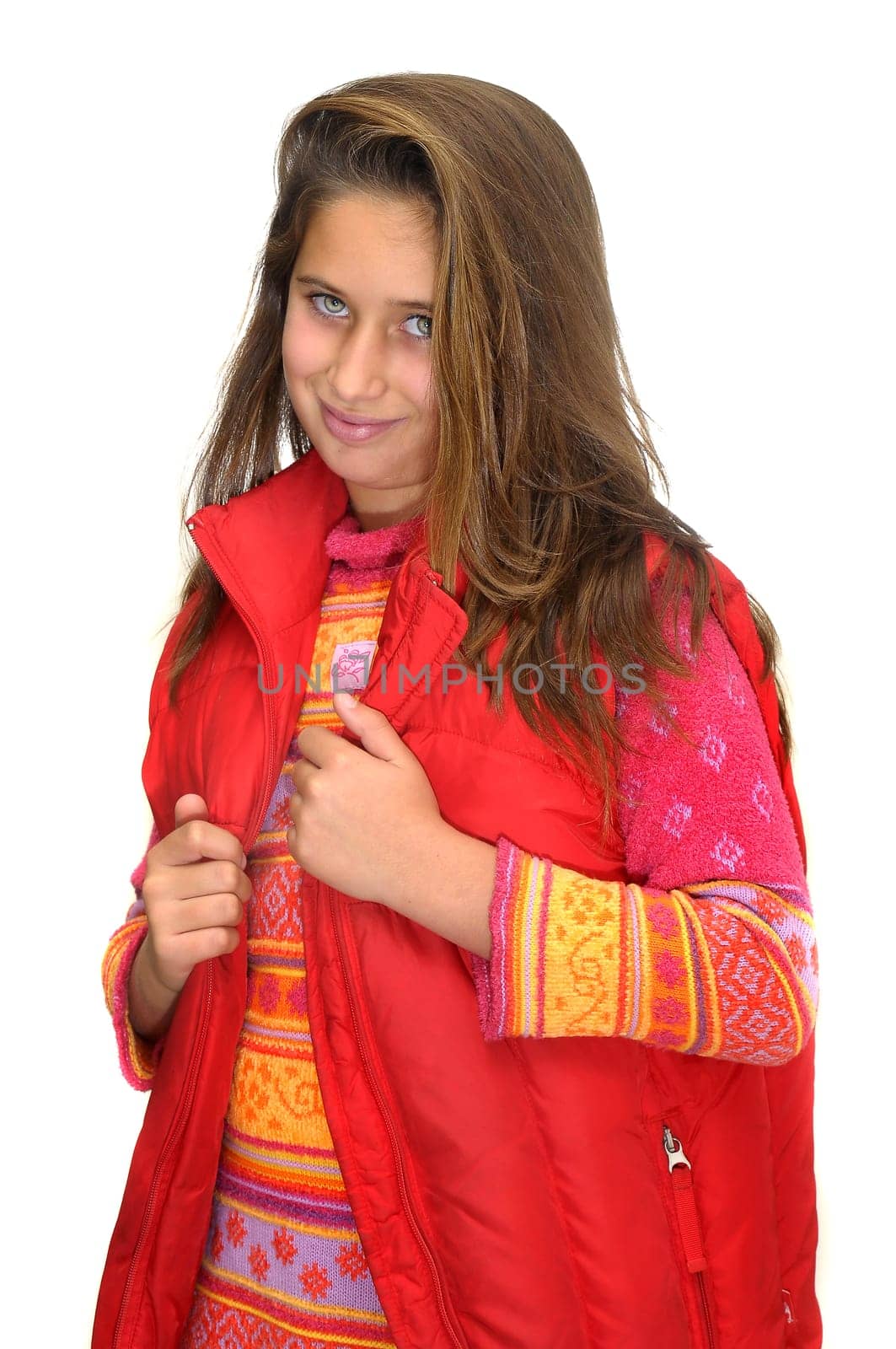 Beautiful young girl posing against a white background