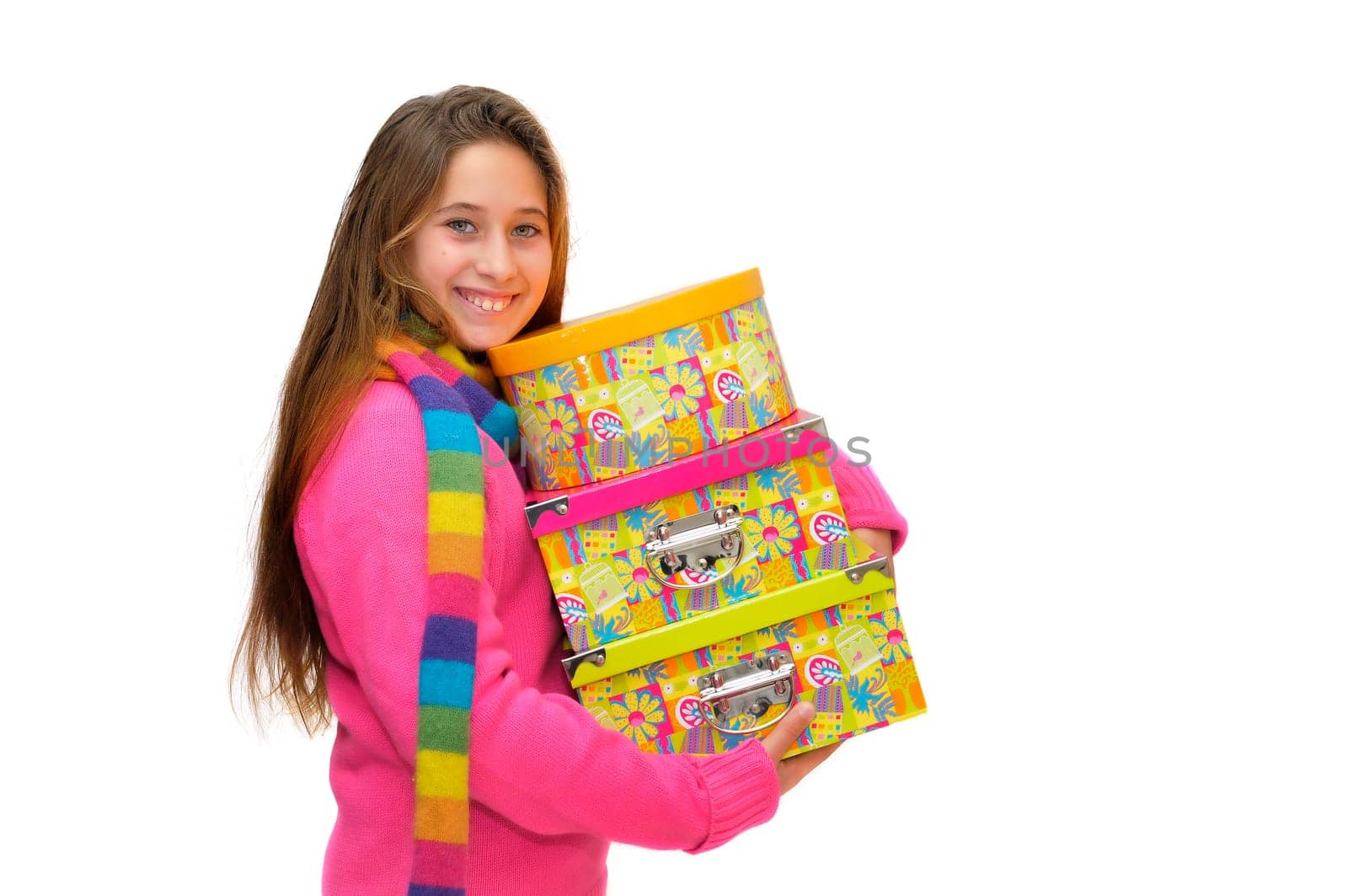 Beautiful young girl with present boxes isolated in white
