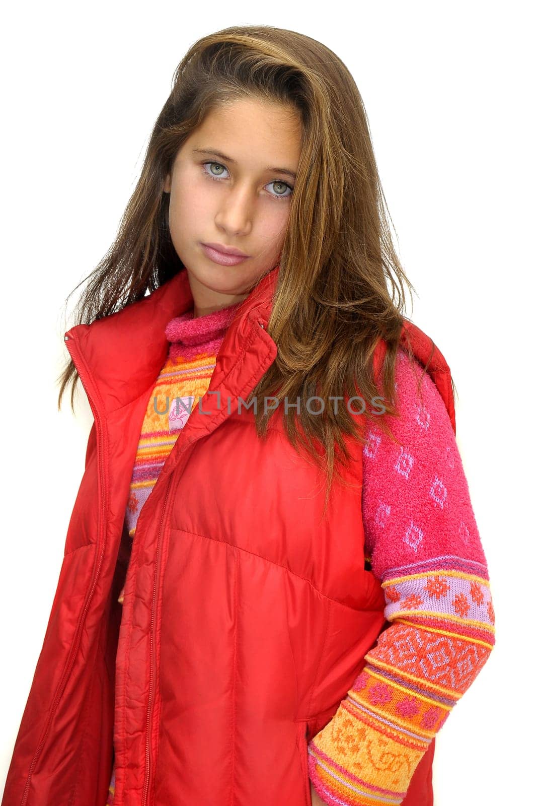 Beautiful young girl posing against a white background