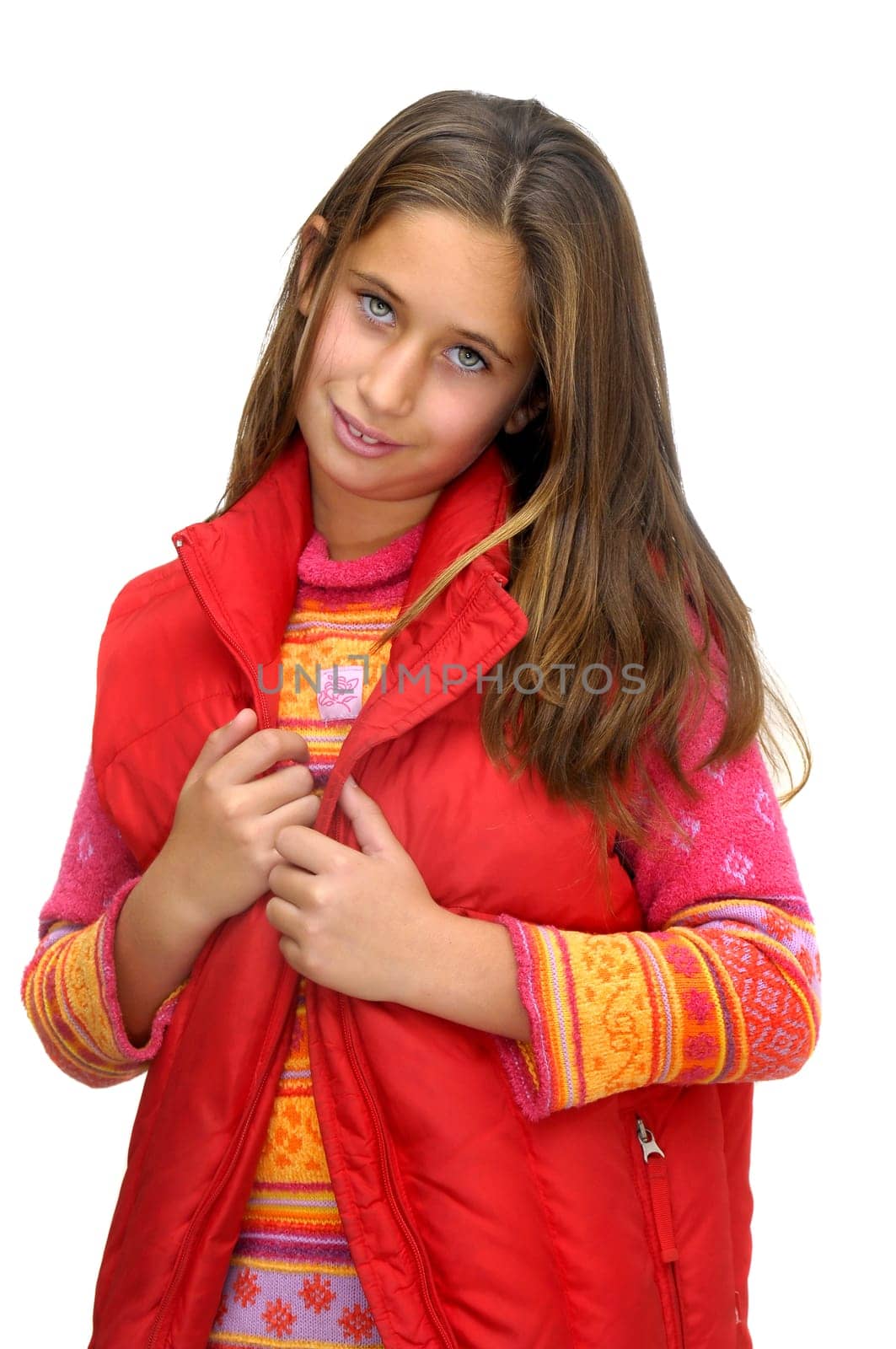 Beautiful young girl posing against a white background