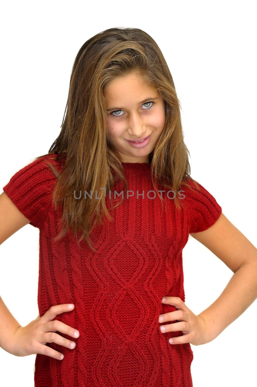 Beautiful young girl posing against a white background