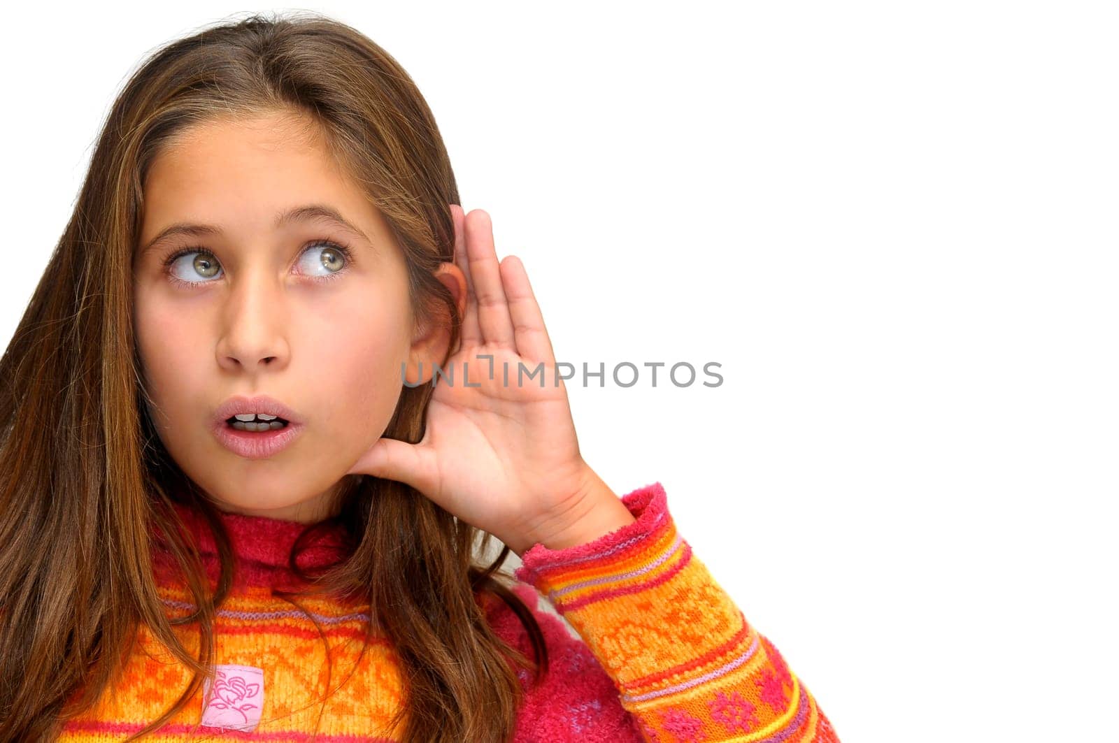 Beautiful young girl listening isolated against a white background