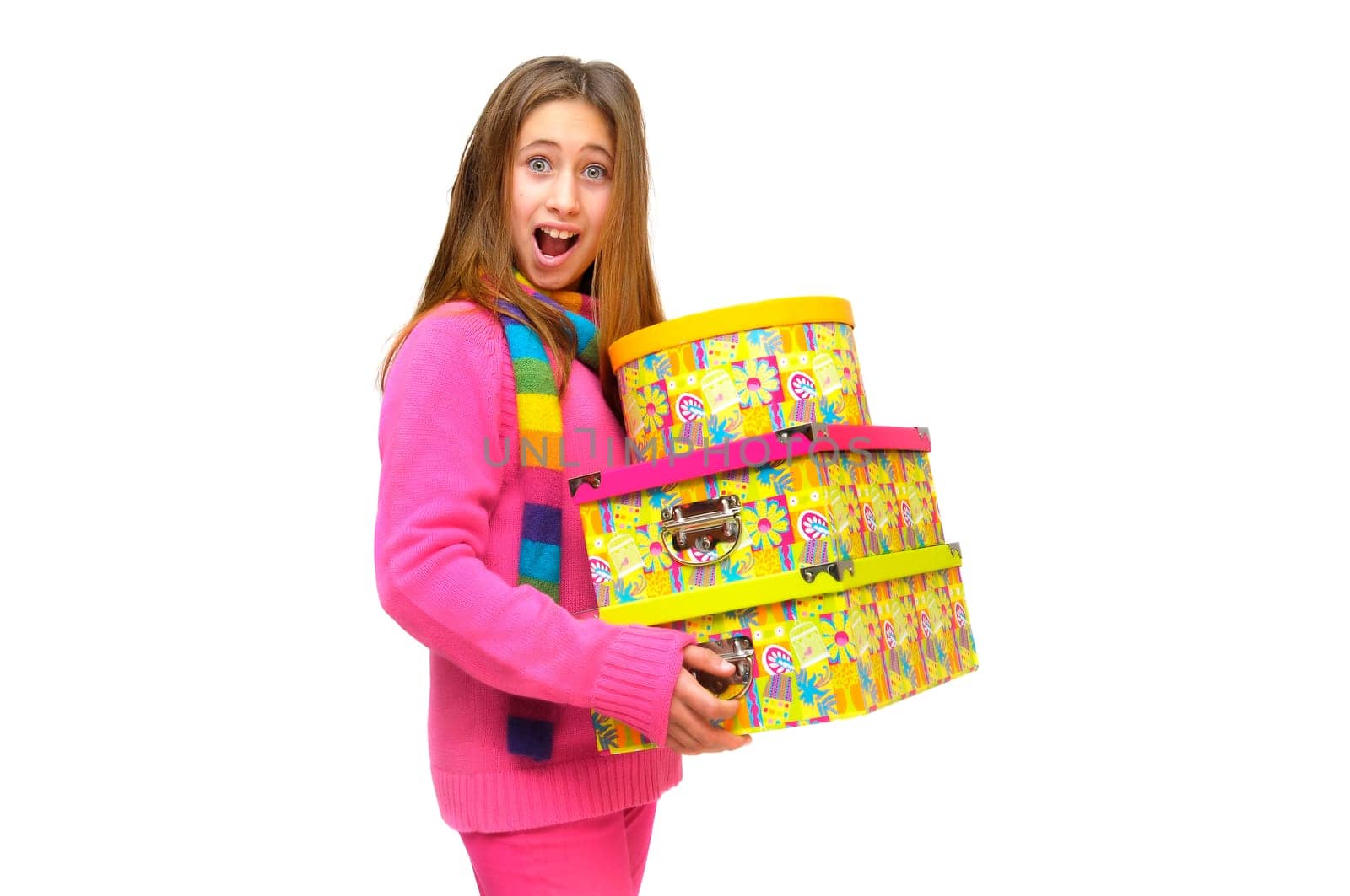 Beautiful young girl with present boxes isolated in white