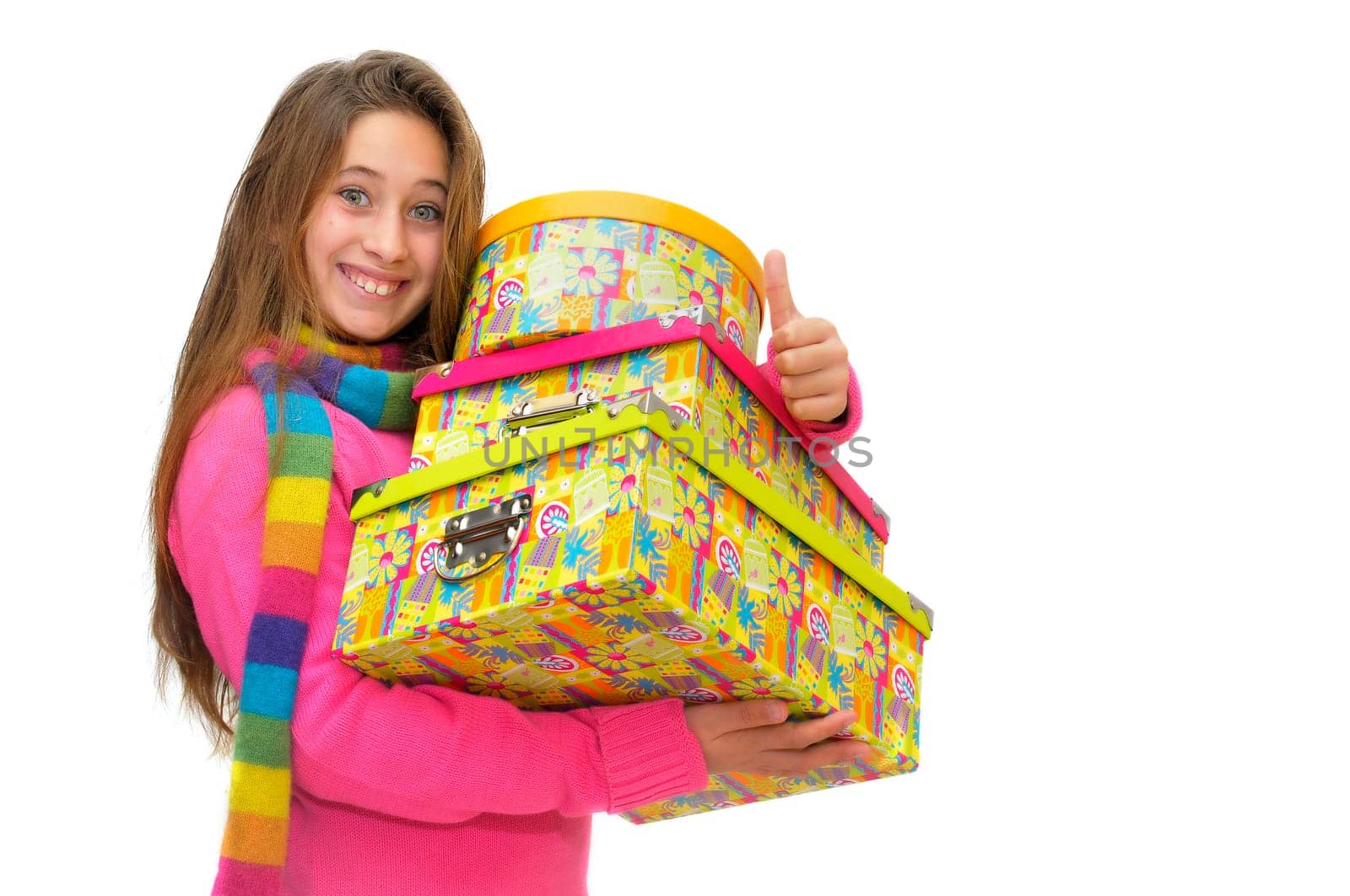 Beautiful young girl with present boxes isolated in white