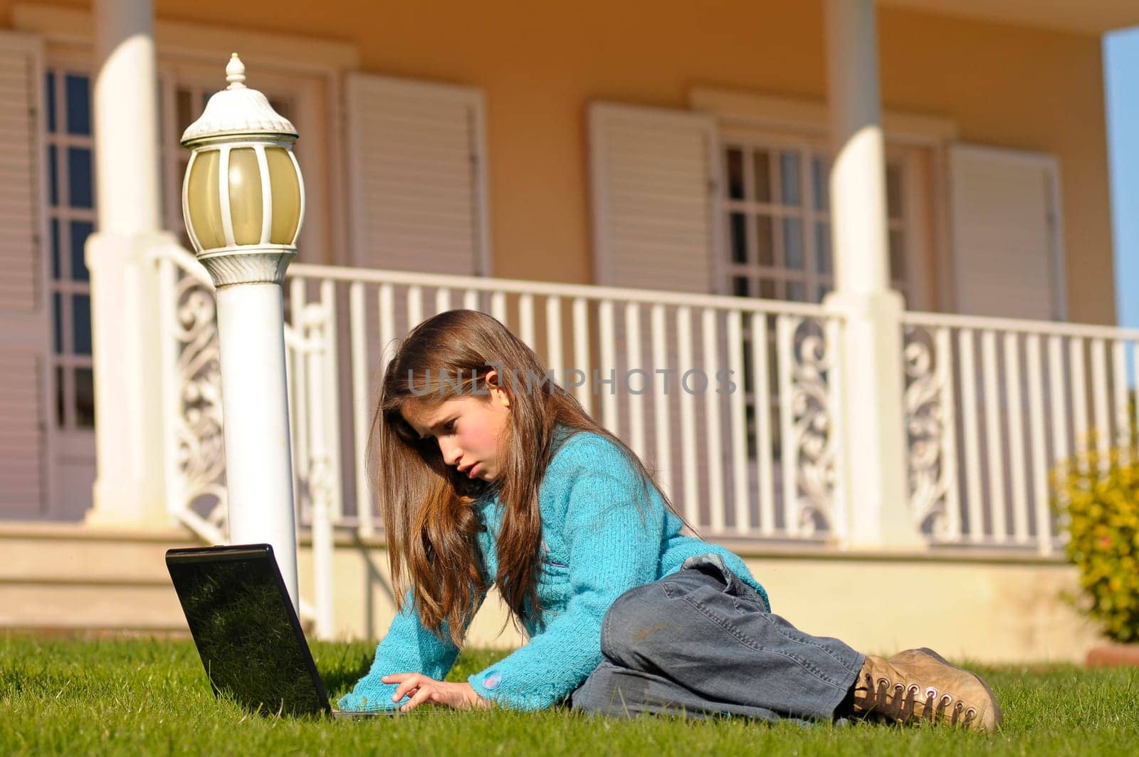 Girl on the grass with laptop
