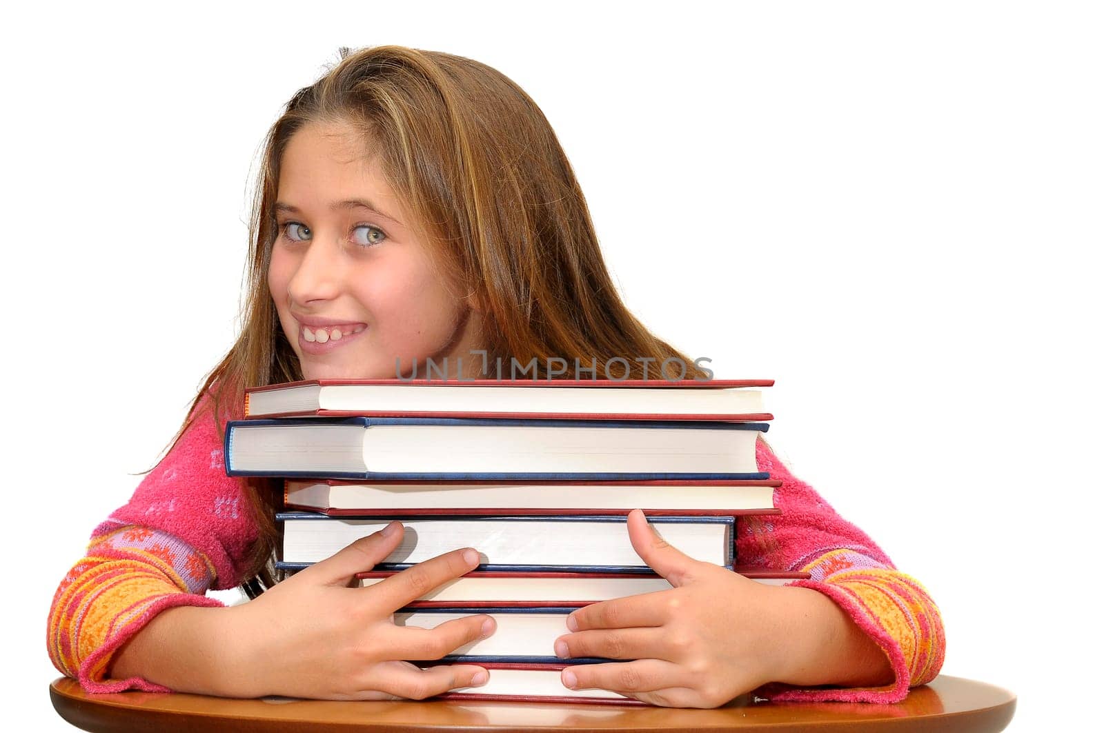 Beautiful young girl posing with books against a white background