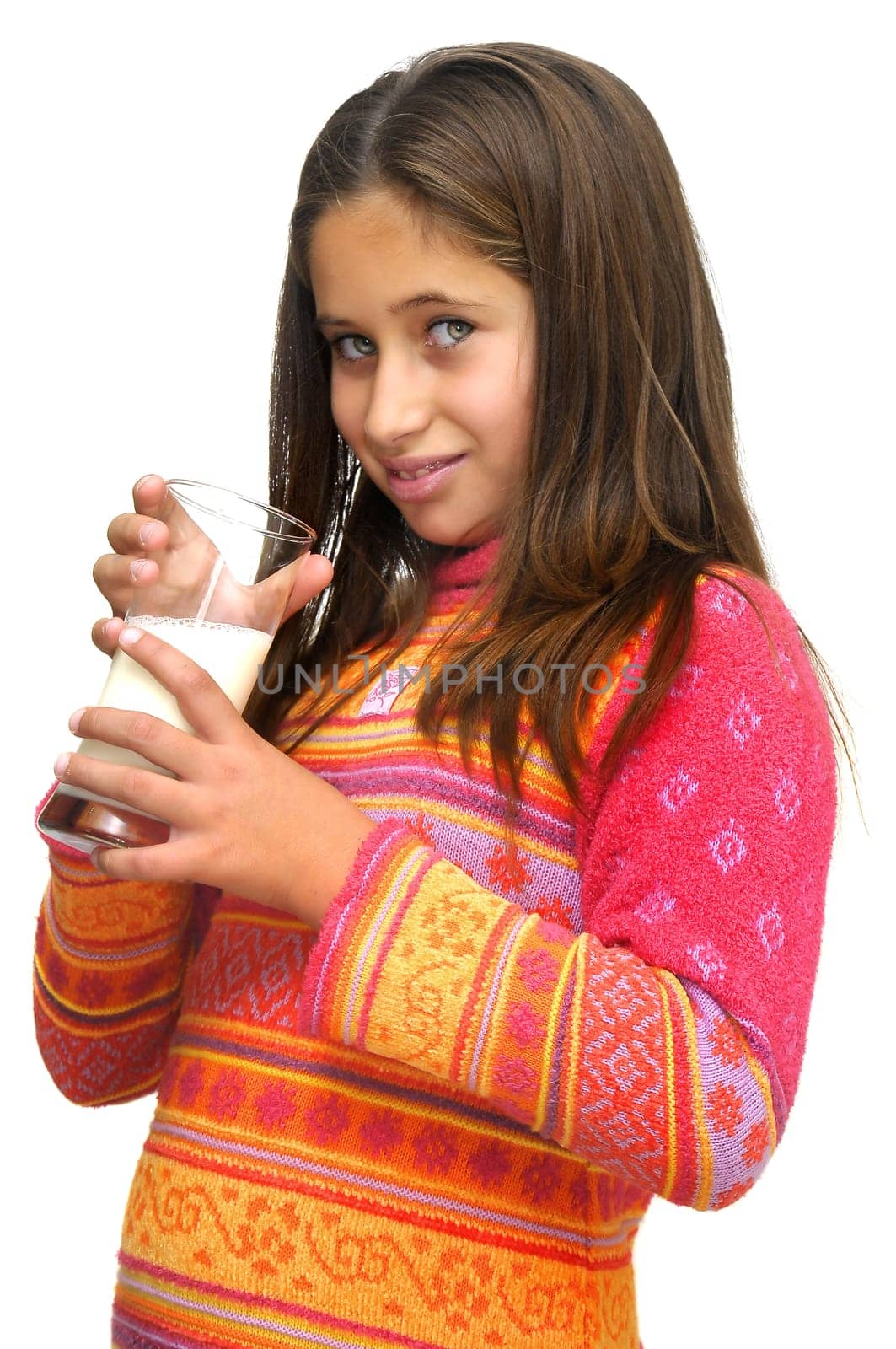 Beautiful young girl drinking milk against a white background