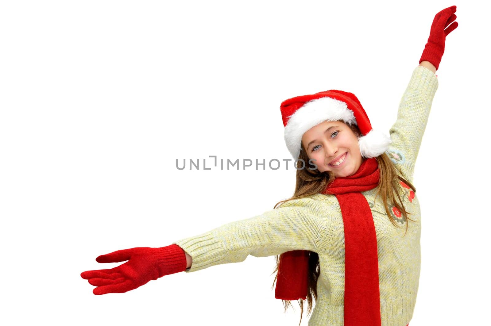 Beautiful young girl with santas hat isolated in white