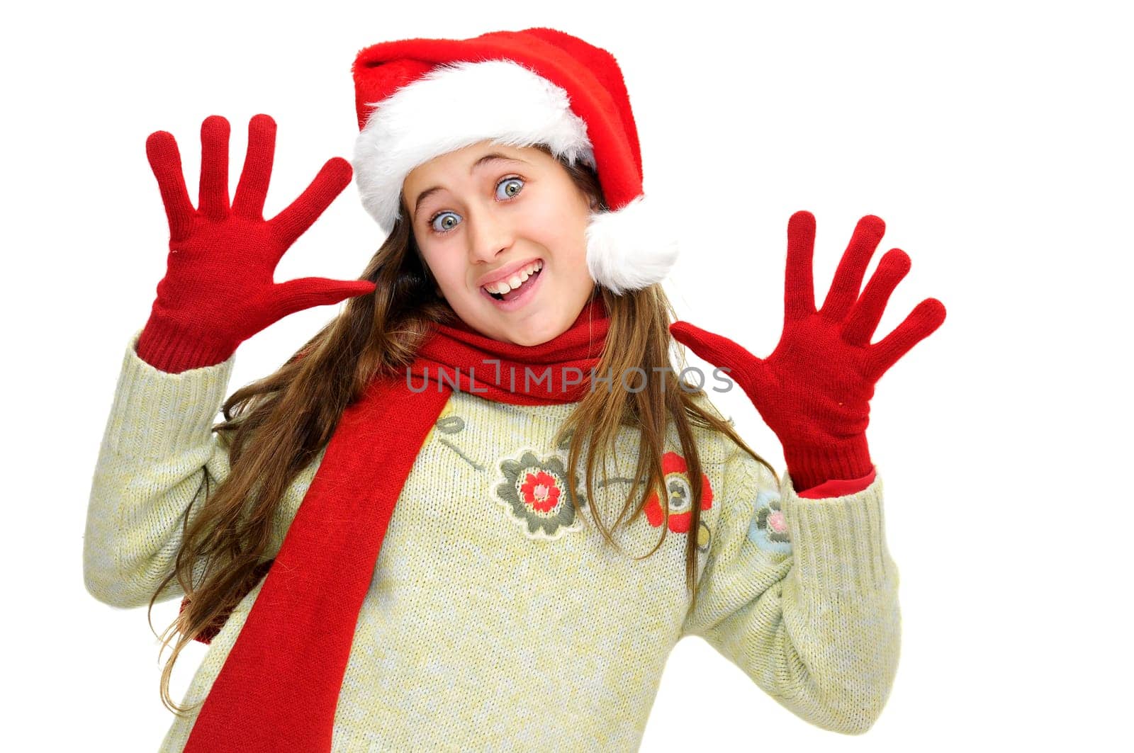 Beautiful young girl with santas hat isolated in white
