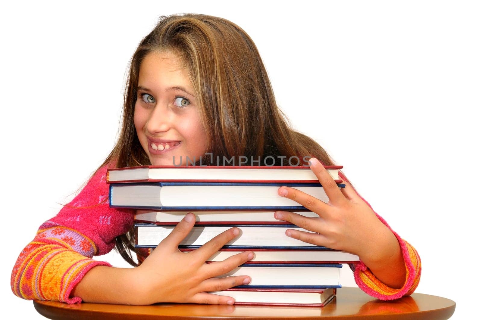 Beautiful young girl posing with books against a white background