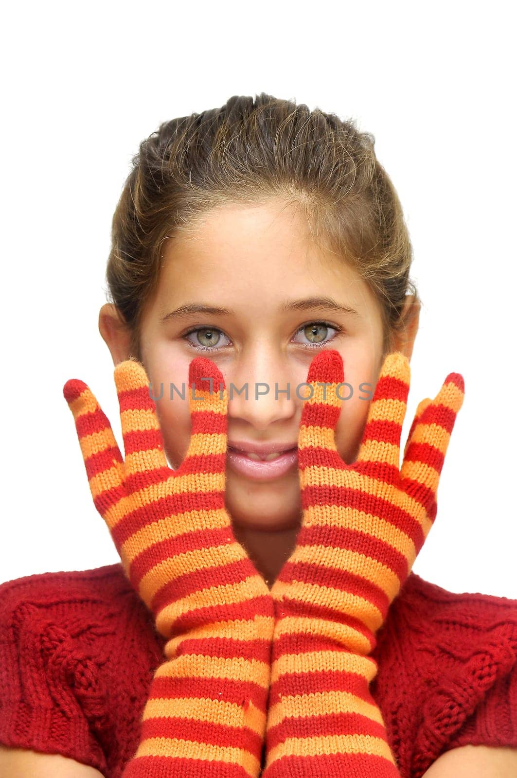 Beautiful young girl posing with gloves against a light background