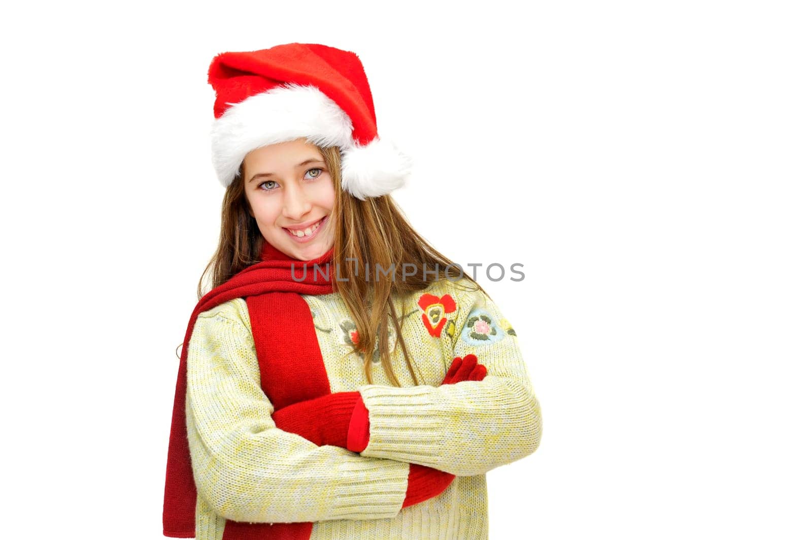 Beautiful young girl with santas hat isolated in white