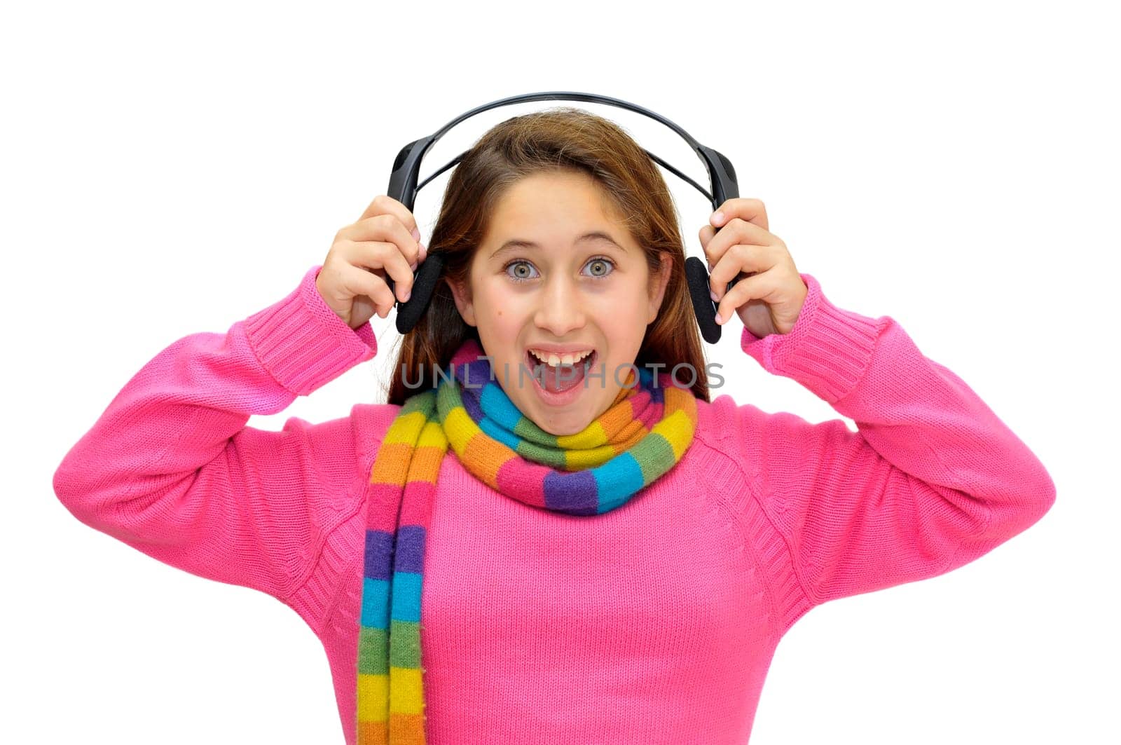 Beautiful young girl with headphones listening music isolated in white