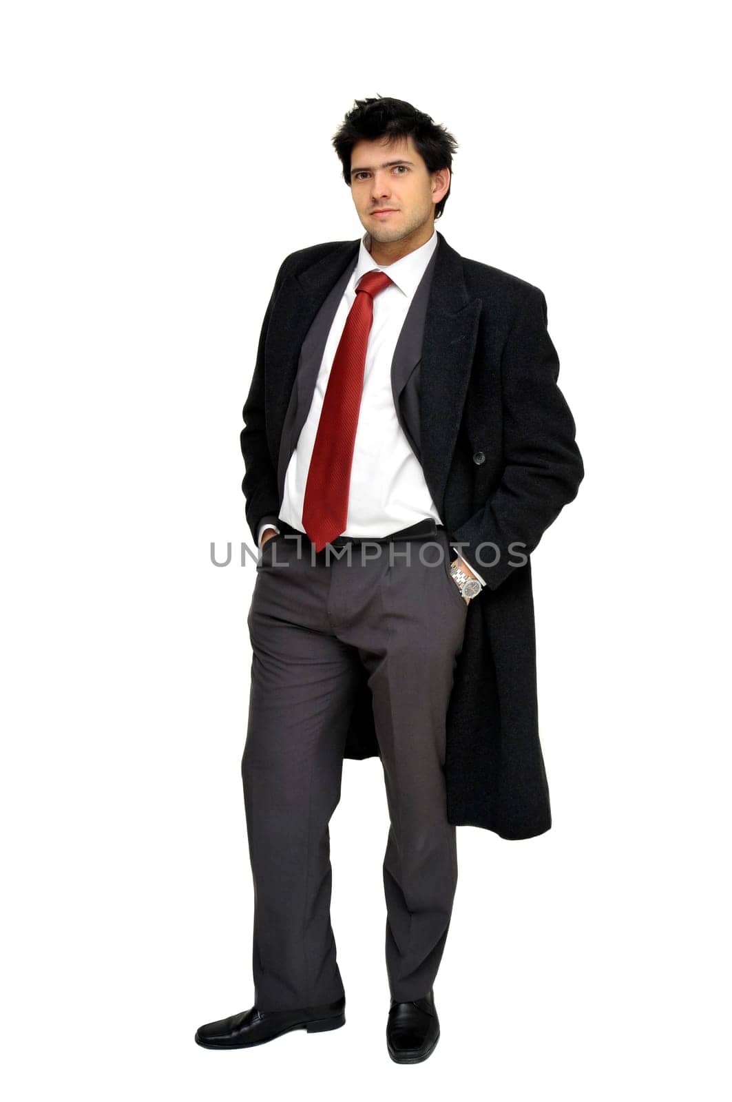 Young businessman posing with greatcoat isolated in white
