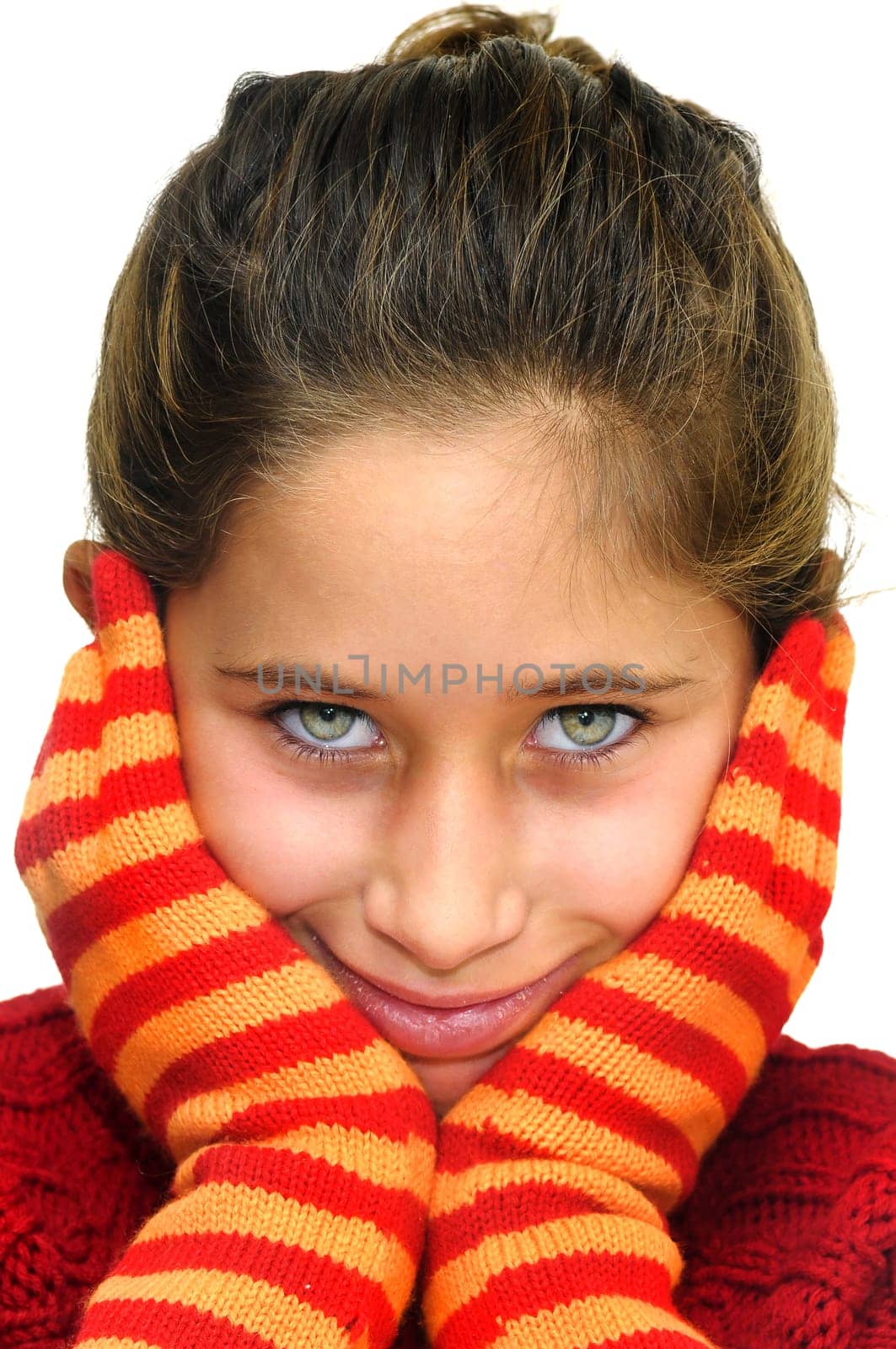 Beautiful young girl posing with gloves against a white background