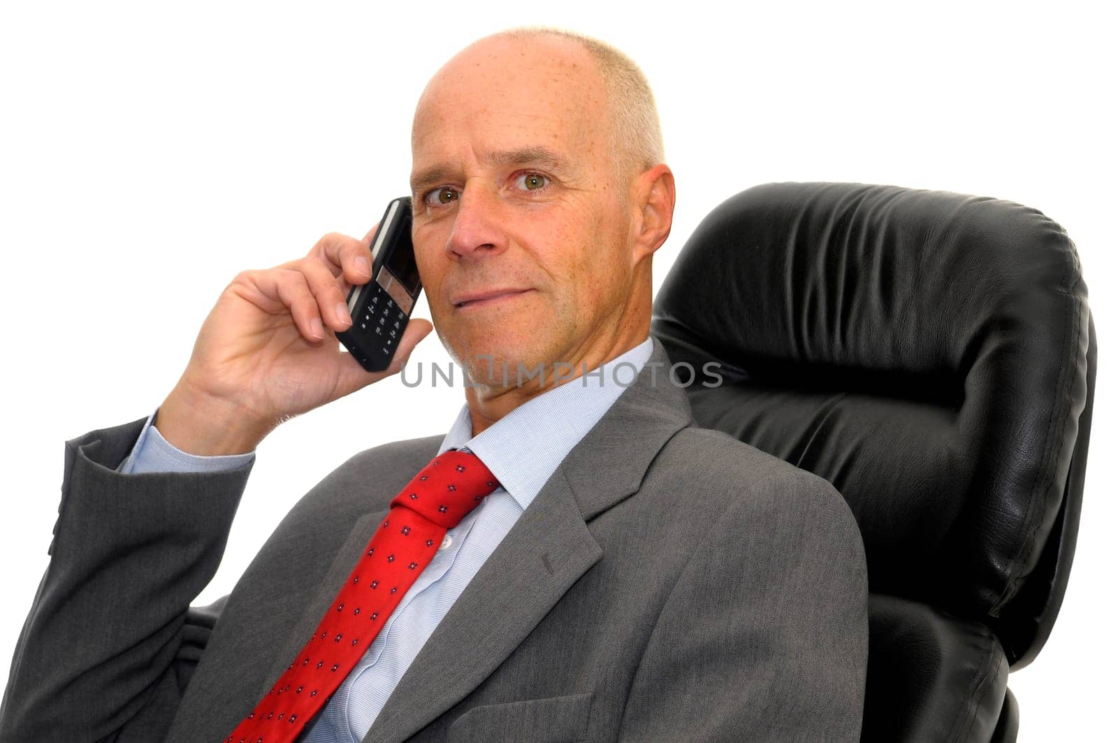 Mature man with cellphone isolated in white