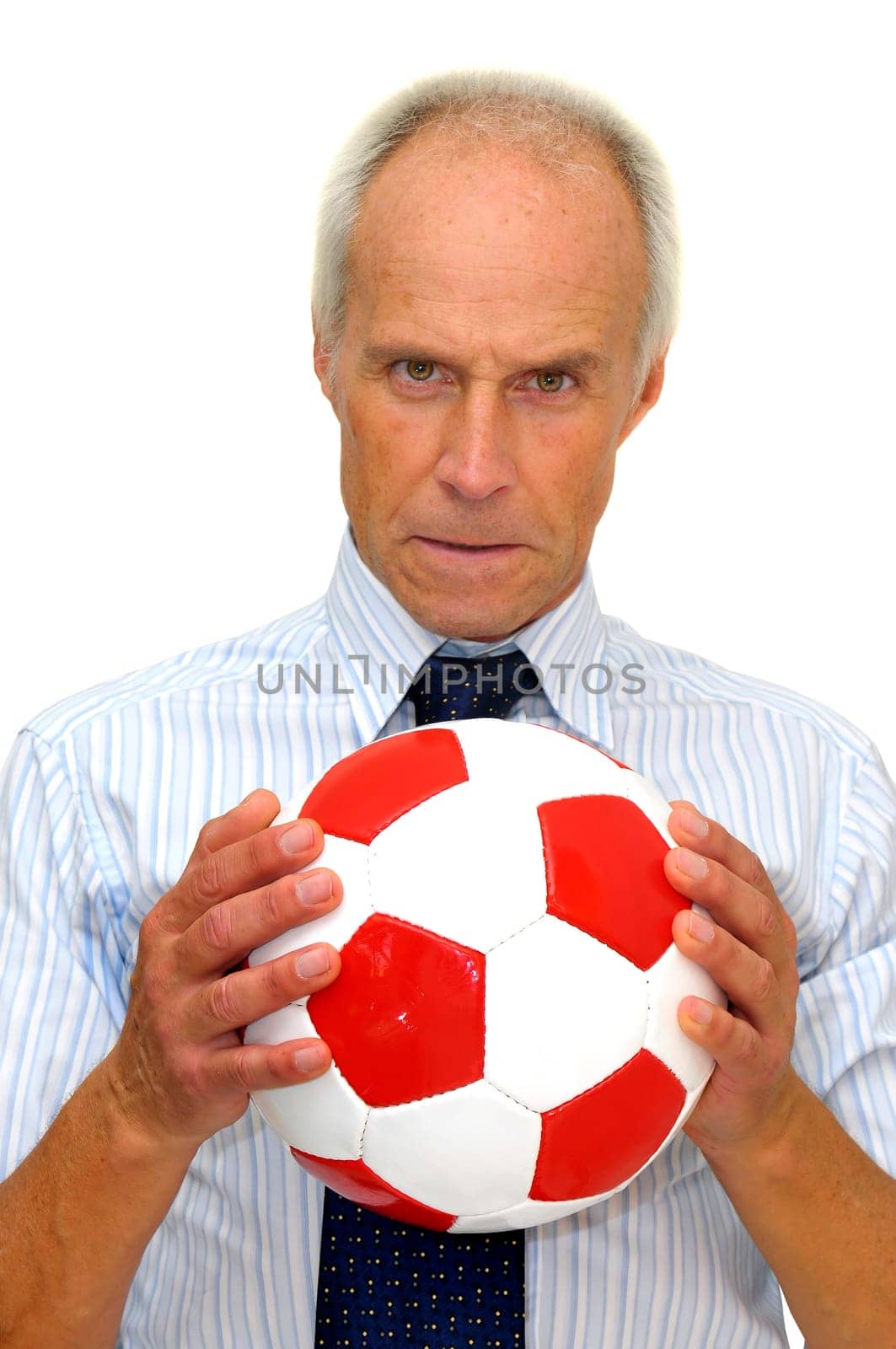 Businessman with a soccer ball isolated in white