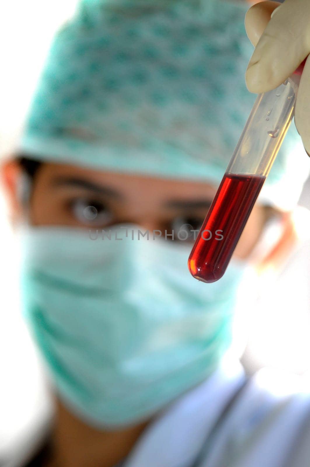 Young doctor analyzing a blood sample