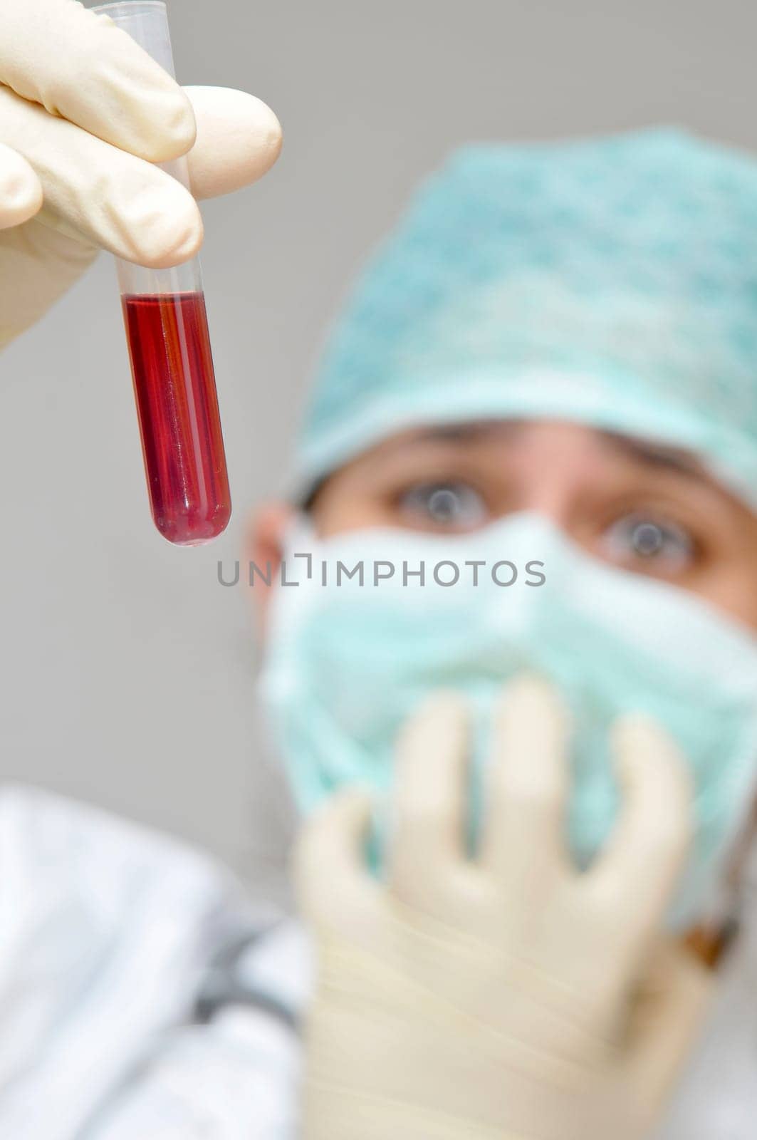 Young doctor analyzing a blood sample