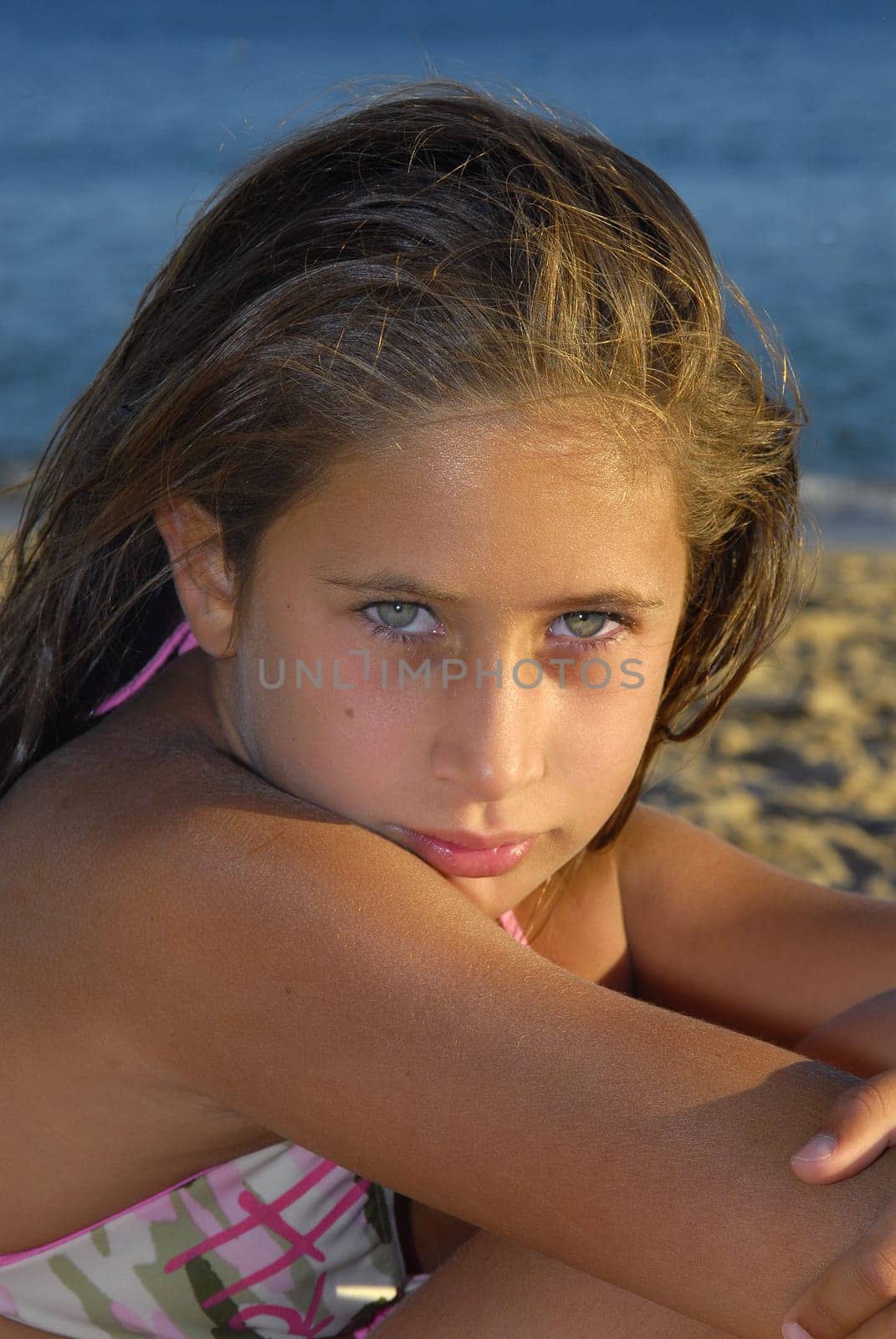 Beautiful young girl posing in the beach