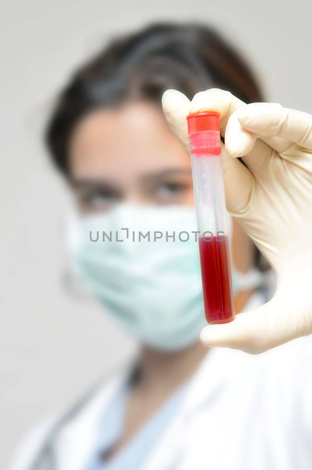Young doctor analyzing a blood sample