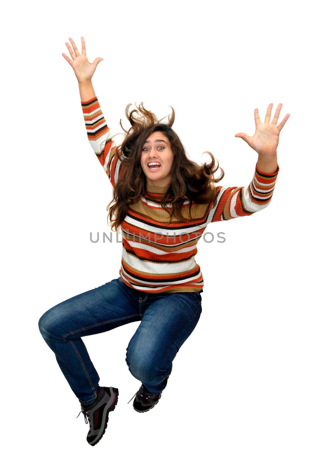 Beautiful teen jumping isolated in white