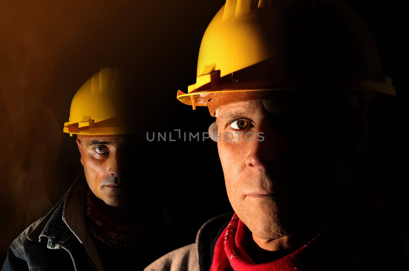 Workers team isolated in black