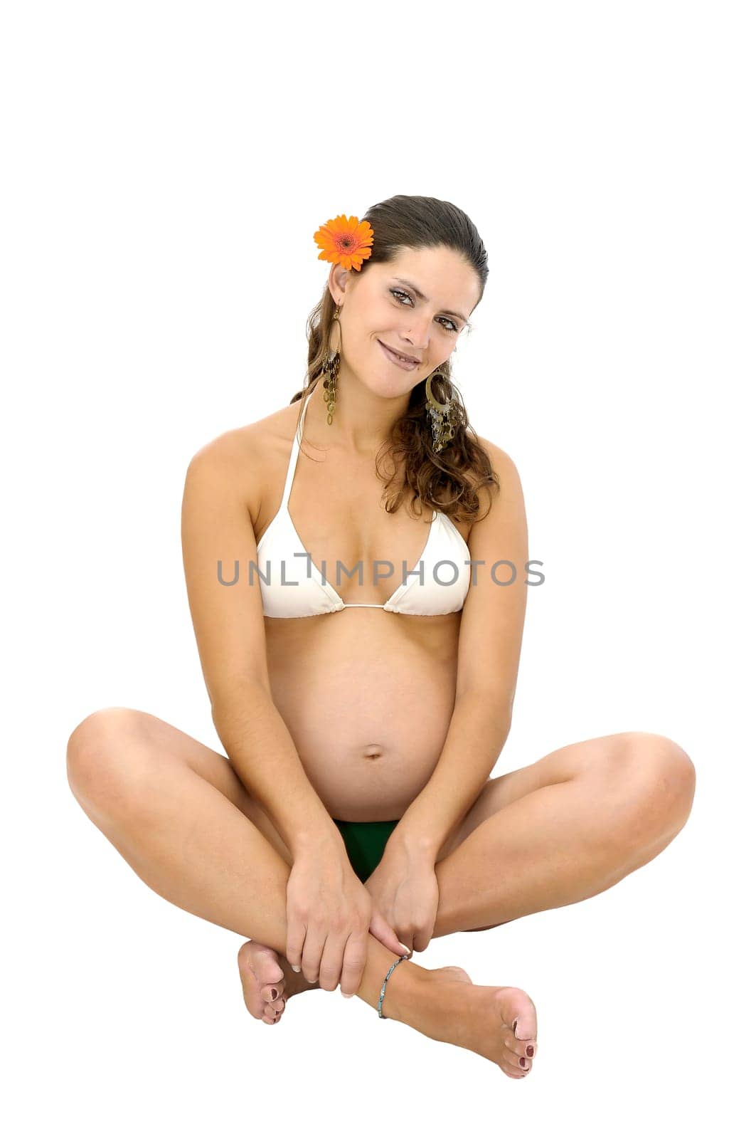 Pregnant woman with tattoo in bikini isolated in white
