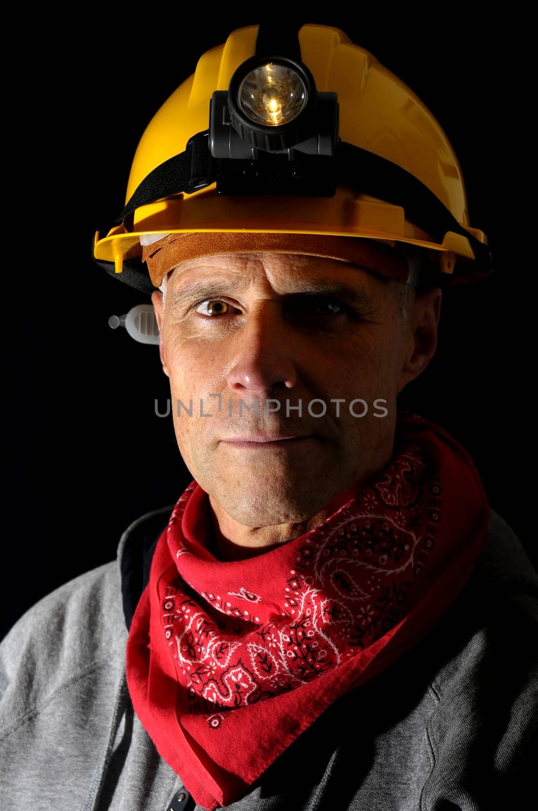 Portrait of a worker isolated in black